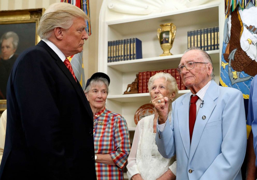 PHOTO: In this file photo taken on July 21, 2017, U.S. President Donald Trump listens to USS Arizona survivor Donald Stratton, right, during a meeting with survivors of the 1941 attack at Pearl Harbor, in the Oval Office of the White House in Washington.