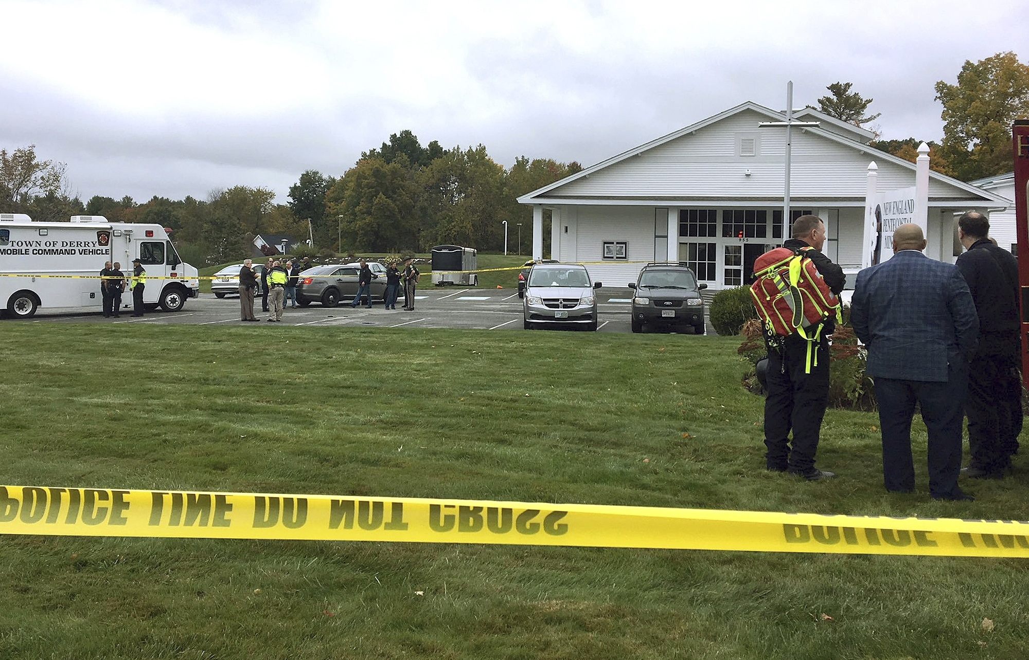 PHOTO: In this photo provided by WMUR-TV, police stand outside the New England Pentecostal Church after reports of a shooting on Oct. 12, 2019, in Pelham, N.H.