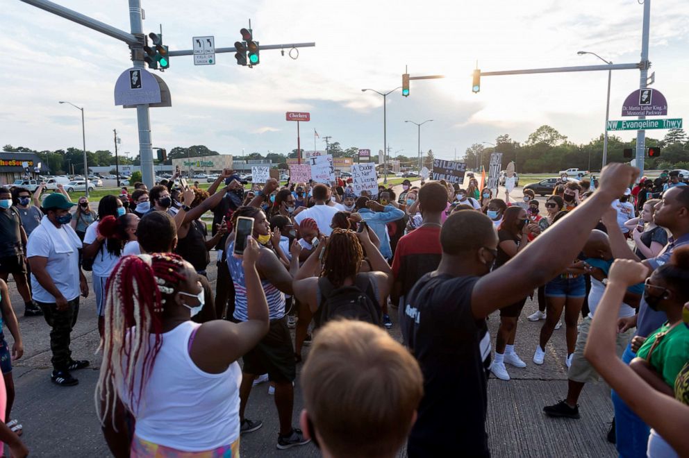 PHOTO: Protesters take to the street and block traffic at the intersection of Willow St and Evangeline Thruway after a vigil held for Trayford Pellerin, 31, who was shot and killed by Lafayette police officers while armed with a knife, Aug. 22, 2020.