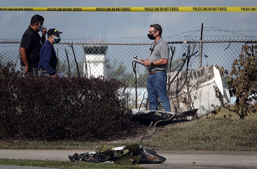 PHOTO: NTSB investigators work the scene of a plane crash near North Perry Airport in Pembroke Pines, Fla., March 16, 2021.