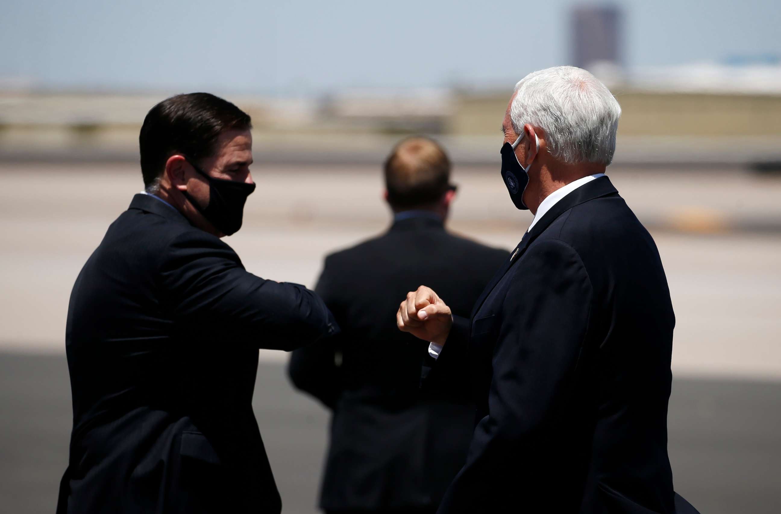 PHOTO: Vice President Mike Pence, right, is greeted with an elbow bump by Arizona Gov. Doug Ducey, left, as he arrives to discuss the surge in coronavirus cases Wednesday, July 1, 2020, in Phoenix.