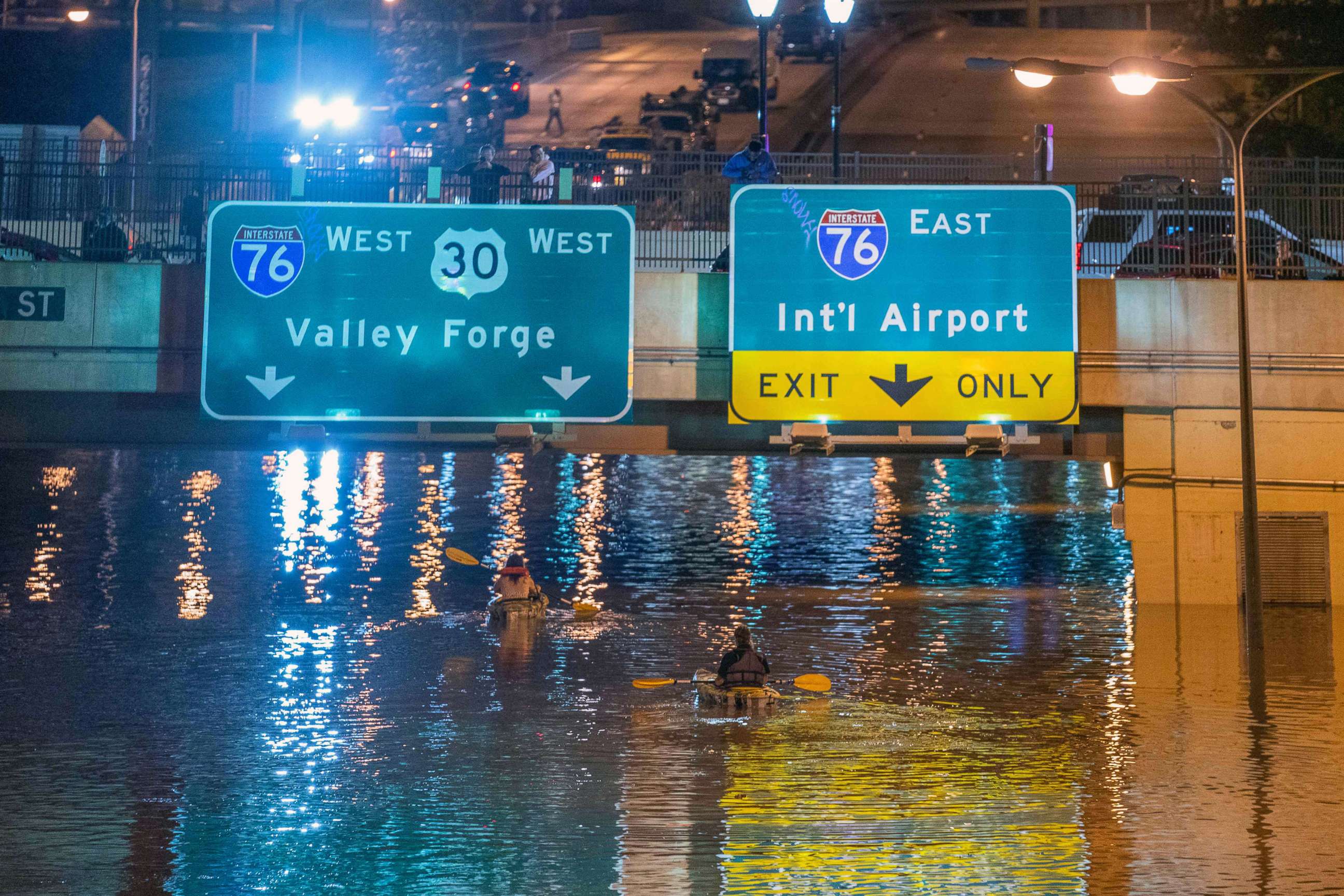 PHOTO: Kayakers paddle down a portion of Interstate 676 after flooding from heavy rains from hurricane Ida in Philadelphia, Sept. 2, 2021.