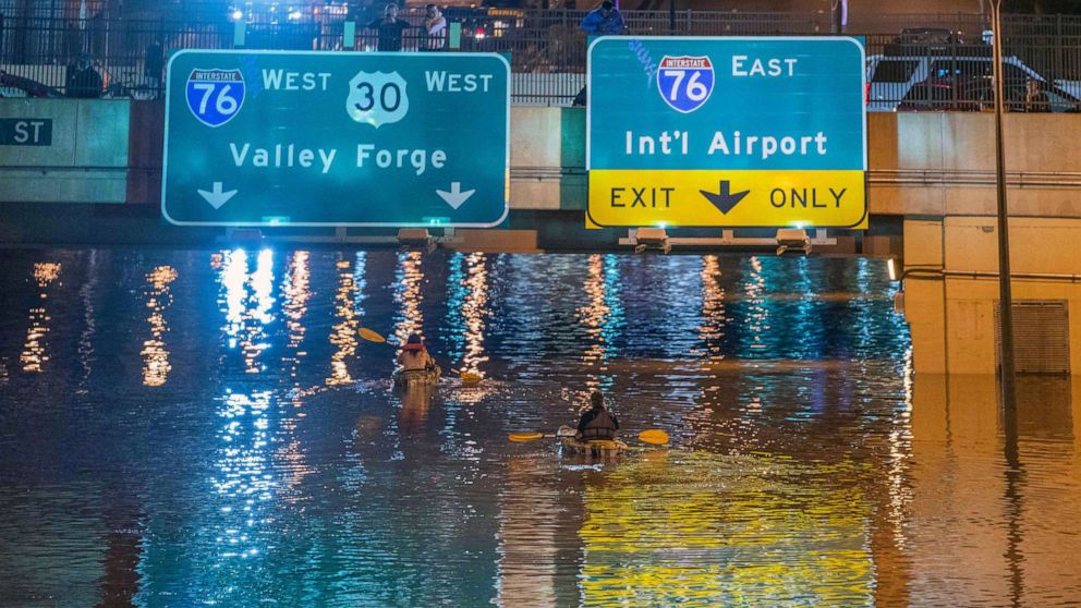PHOTO: Kayakers paddle down a portion of Interstate 676 after flooding from heavy rains from hurricane Ida in Philadelphia, Sept. 2, 2021.
