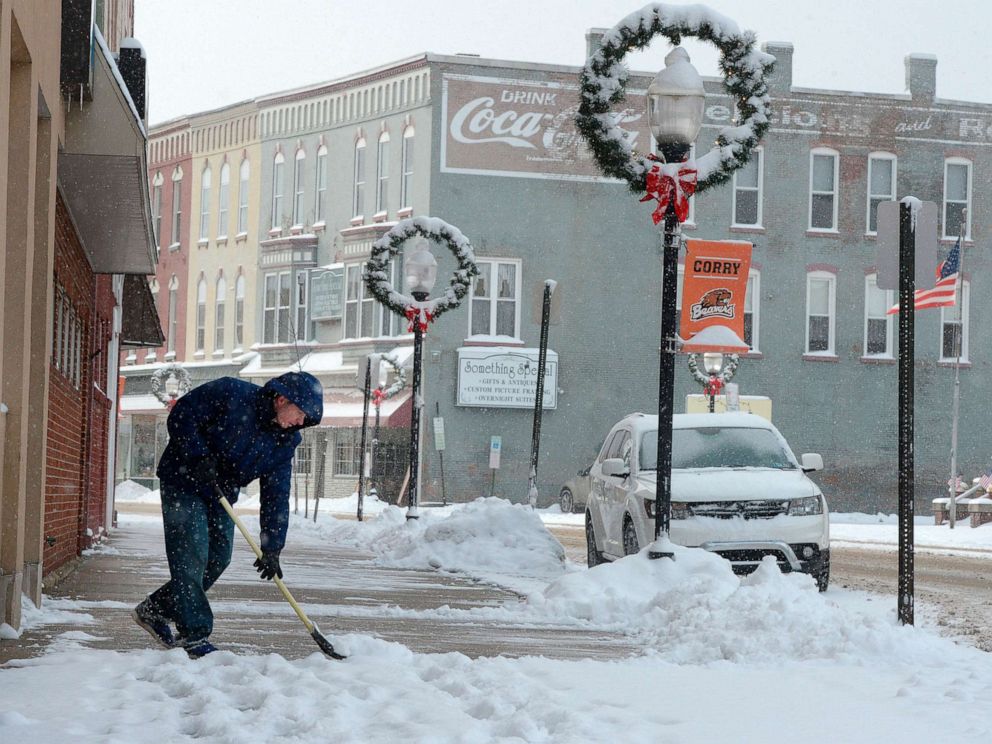 PHOTO: Ben Barney shovels the sidewalk on North Center Street in downtown Corry, Pennsylvania, Nov. 12, 2019. 