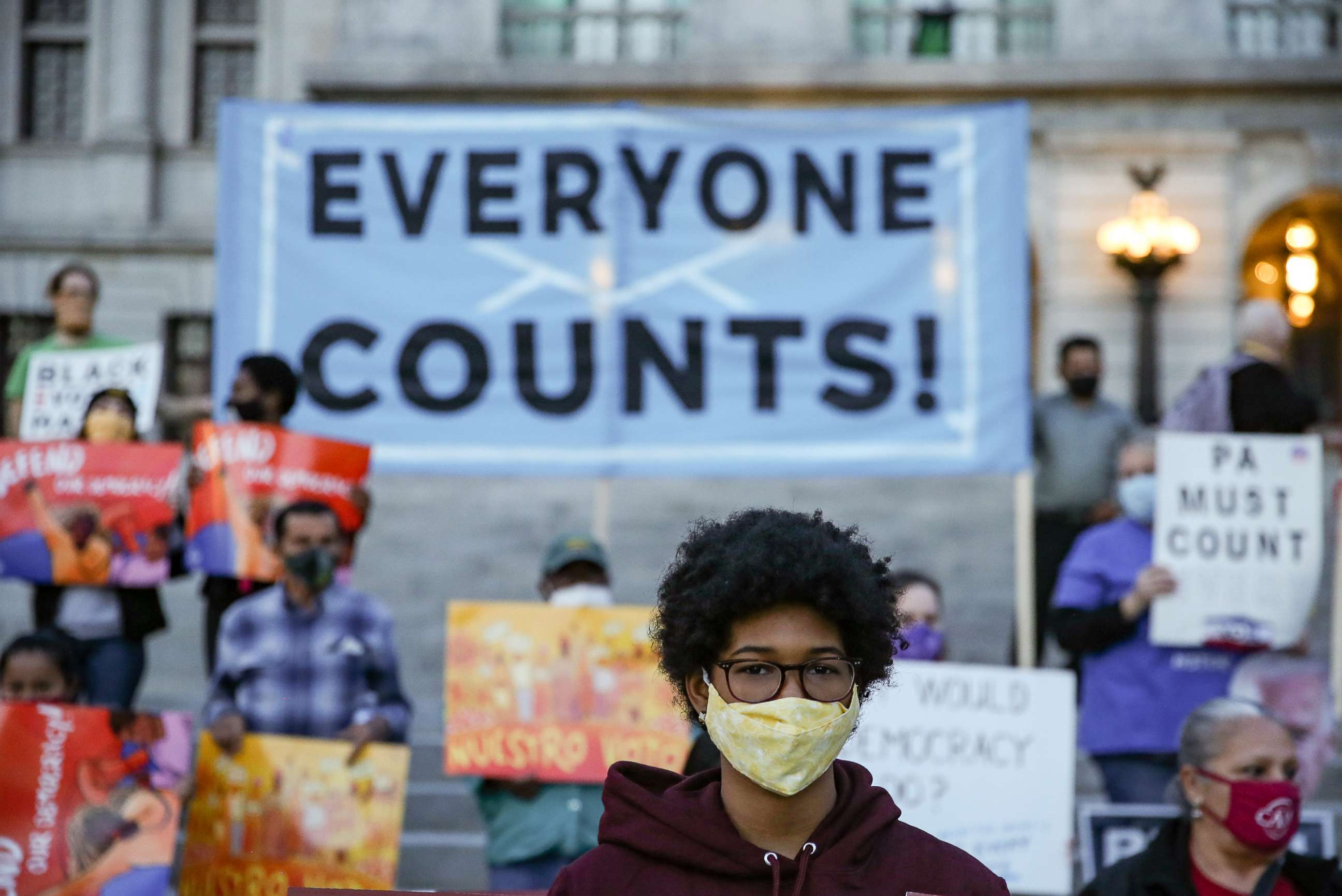 PHOTO: Children and adults take part in a display of the "Count Every Vote" slogan during a Count Every Vote demonstration at the Pennsylvania State Capitol on Nov. 5, 2020 in Harrisburg, Penn.