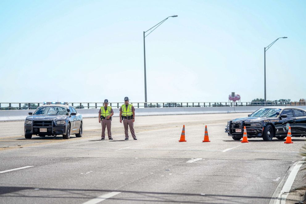 PHOTO: Florida State Troopers block traffic over the Bayou Grande Bridge leading to the Pensacola Naval Air Station following a shooting on December 06, 2019 in Pensacola, Florida.