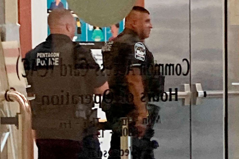 PHOTO: Pentagon police officers walk near the facility's Metro station, Aug. 3, 2021, at the Pentagon in Washington.