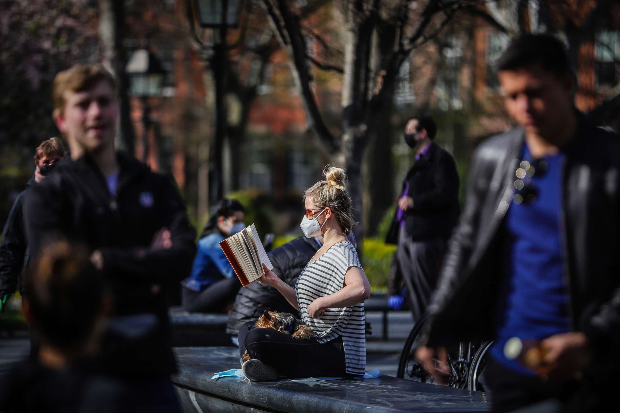 PHOTO: People enjoy the outdoors in New York's Washington Square Park, April 11, 2020.