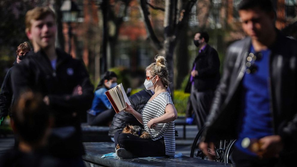 PHOTO: People enjoy the outdoors in New York's Washington Square Park, April 11, 2020.