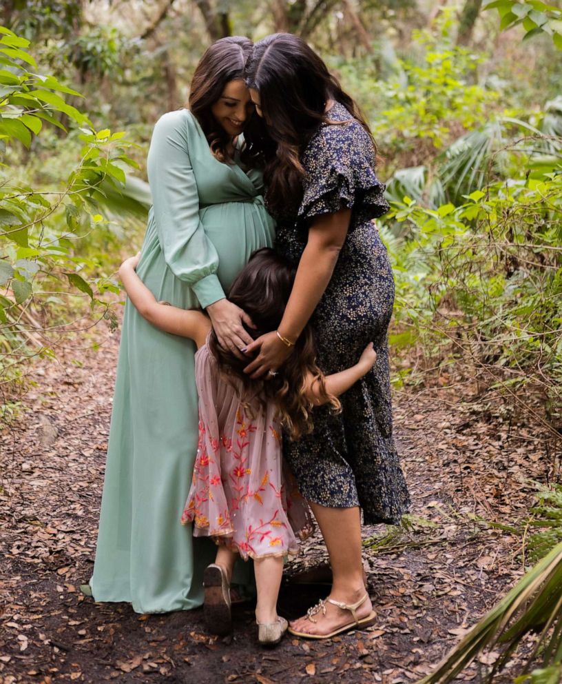 PHOTO: Monica, left, and Janelle, right, with their daughter Olivia.