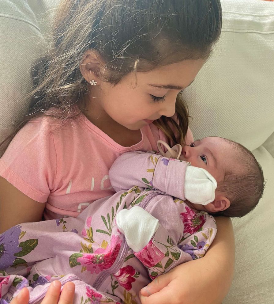 PHOTO: Olivia holds her baby sister Celeste.
