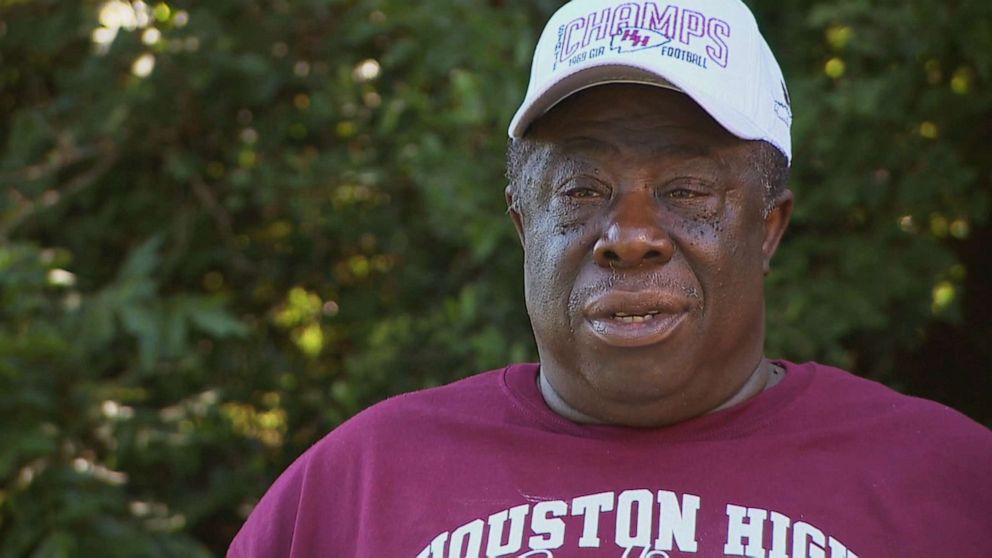 PHOTO: Carl Lumpkin talks to reporters about his experience as part of the all-Black Houston High School football team when it won the state title 50 years ago in Perry, Ga., July 11, 2020.