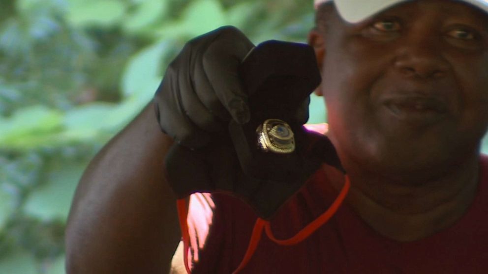 PHOTO: Lawrence Clarington holds up a ring at an event where members of the all-Black Houston High School football team finally received championship rings 50 years after winning the state title, in Perry, Ga., July 11, 2020.