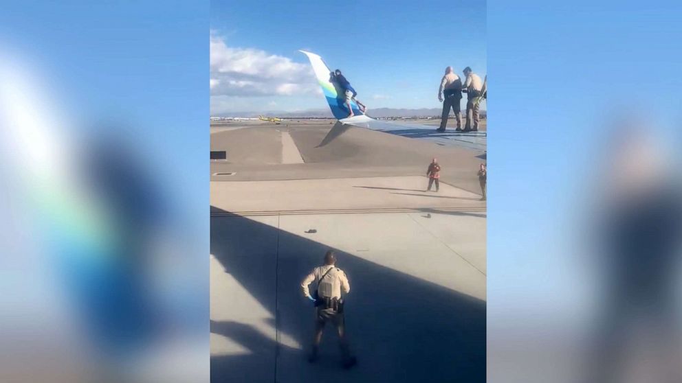 PHOTO: A suspect climbed to the wing of an airplane while it was taxiing prior to takeoff at McCarran Airport in Las Vegas, Dec. 12, 2020.
