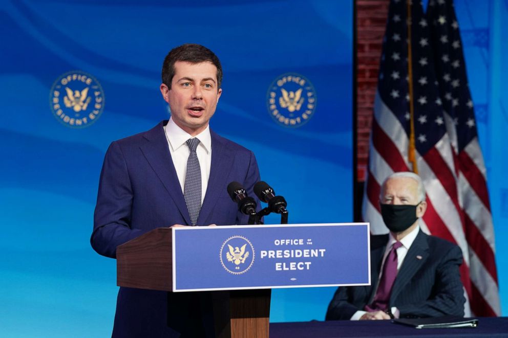 PHOTO: Pete Buttigieg speaks as President-elect Joe Biden looks on after he was nominated to be Secretary of Transportation during a news conference at Biden's transition headquarters on Dec. 16, 2020, in Wilmington, Del.