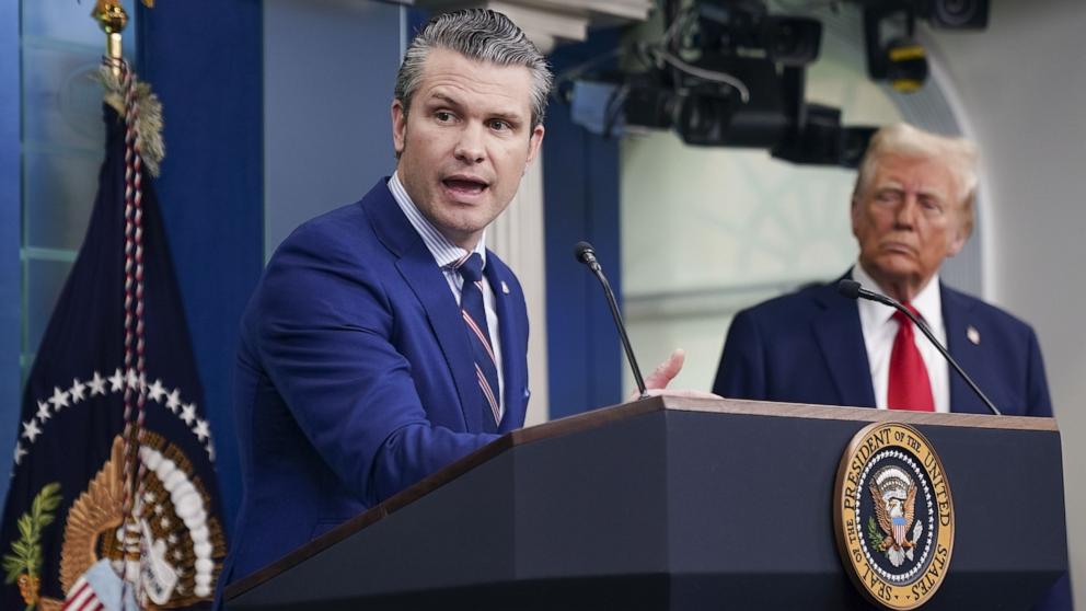 PHOTO: Secretary of Defense Pete Hegseth speaks as US President Donald Trump listens during a press onference called in response to the fatal collision of a passenger airplane and a US military helicopter, at the White House in Washington, Jan. 30, 2025.