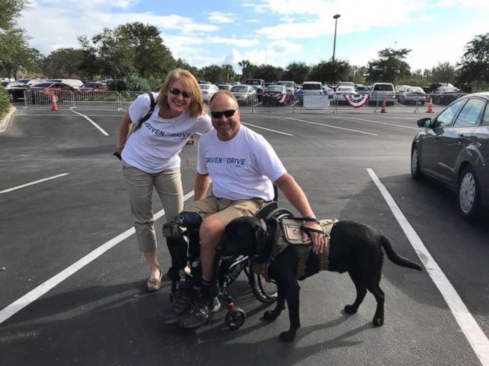PHOTO: Retired Army Major Pete Way with his wife Anne and service dog Rory.