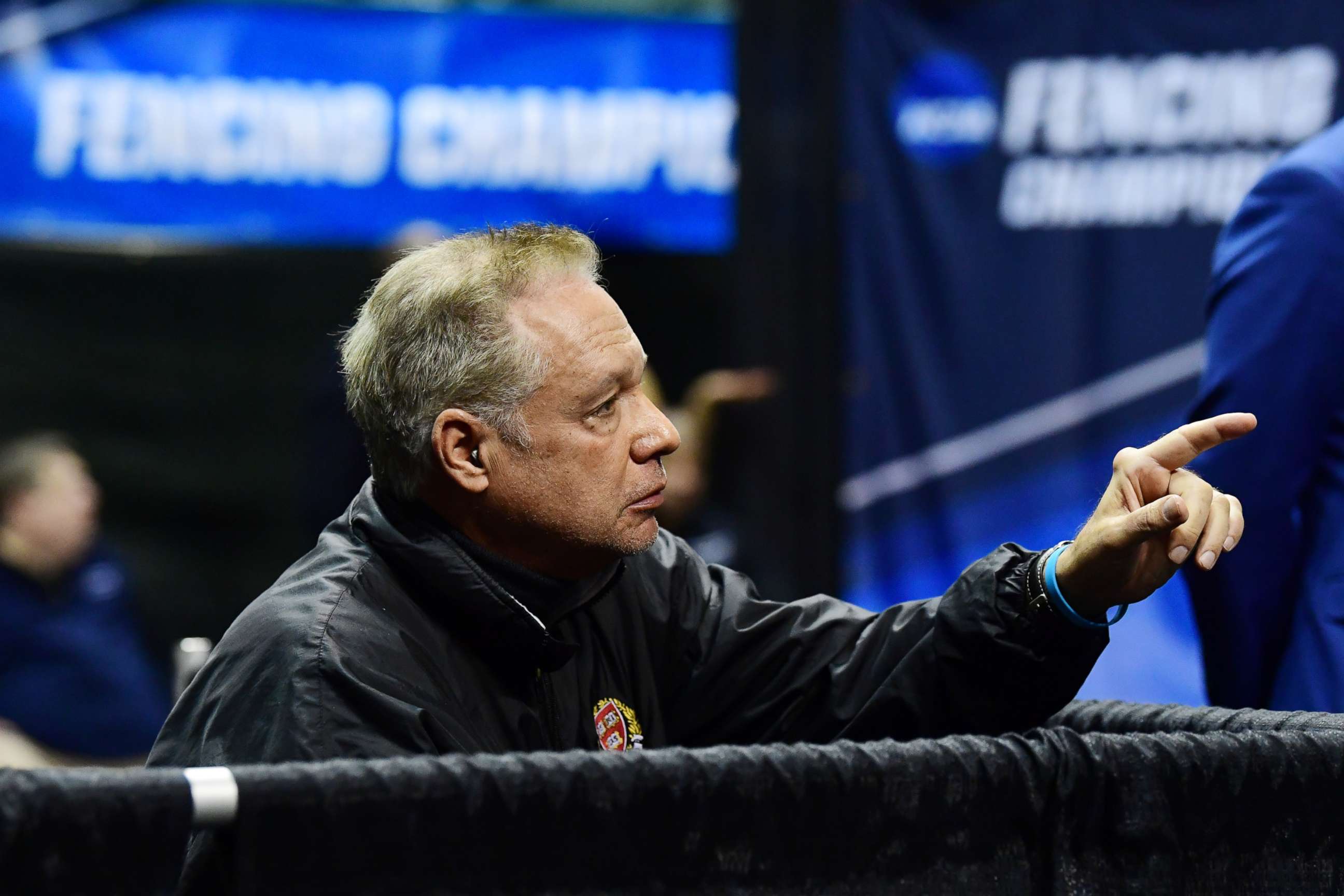 PHOTO: In this March 24, 2019, file photo, head coach Peter Brand talks to a member of the Harvard fencing team during the Division I Women's Fencing Championship held at The Wolstein Center on the Cleveland State University campus in Cleveland.