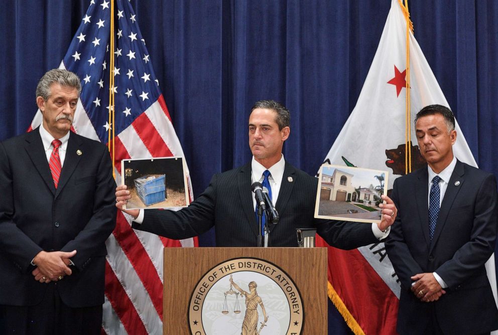 PHOTO: Orange County District Attorney Todd Spitzer holds up pictures of the home of Peter Chadwick and the dumpster where his wife's body was found during a news conference in Santa Ana, Calif., on Tuesday, Aug 6, 2019.