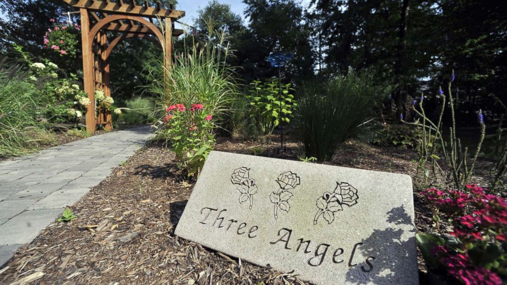 A remembrance garden sits in place where the house of the William Petit family once stood in Cheshire, Conn., Sept. 7, 2010.