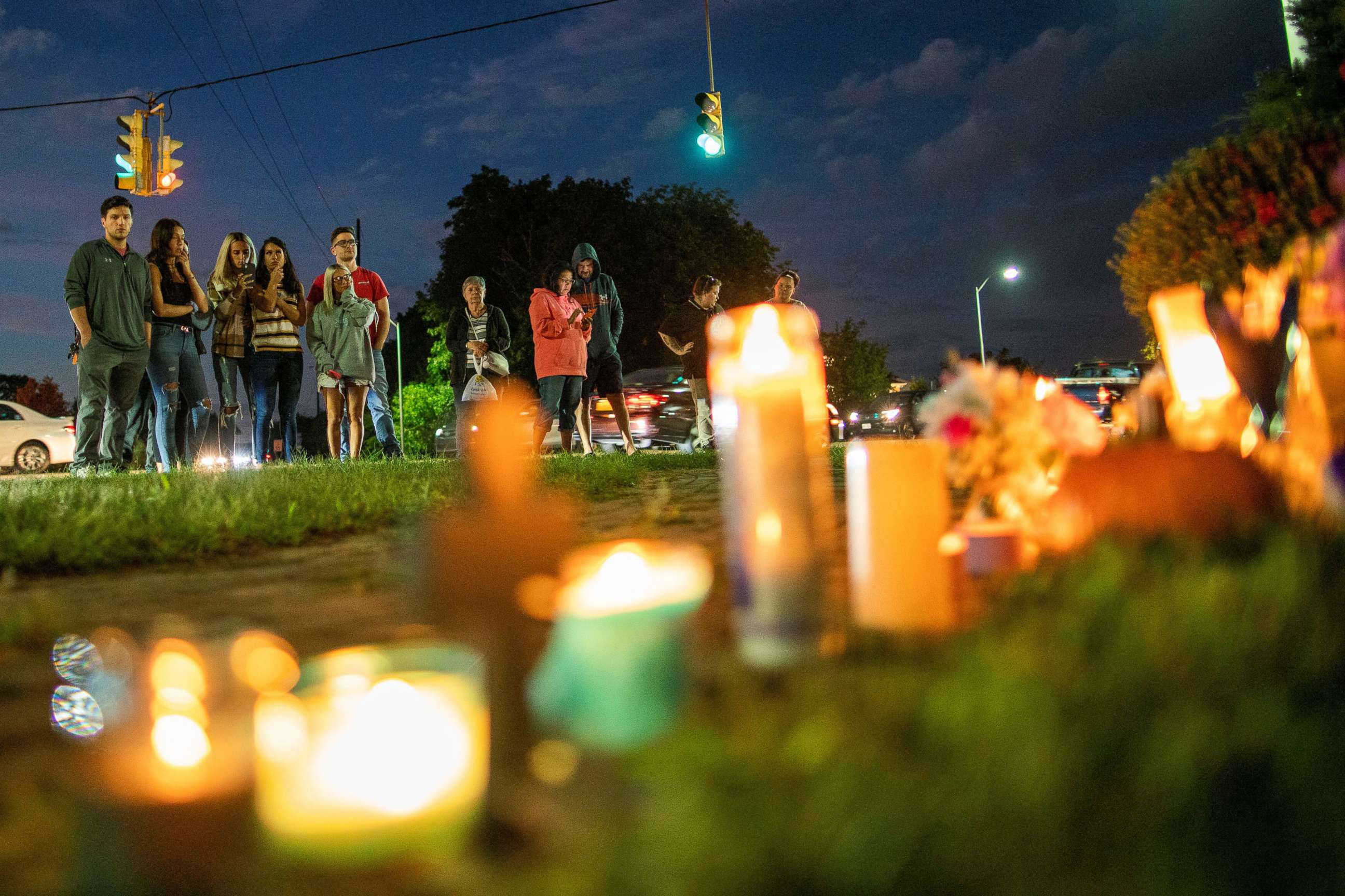 PHOTO: People pay respect in a makeshift memorial during a candlelight vigil for travel blogger Gabby Petito in Blue Point, New York, Sept. 24, 2021.