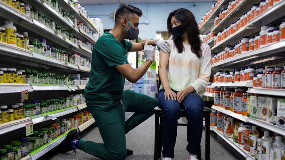 PHOTO: A woman receives the Pfizer-BioNTech coronavirus disease vaccine as a booster dose at Skippack Pharmacy in Schwenksville, Pa., Aug. 14, 2021.