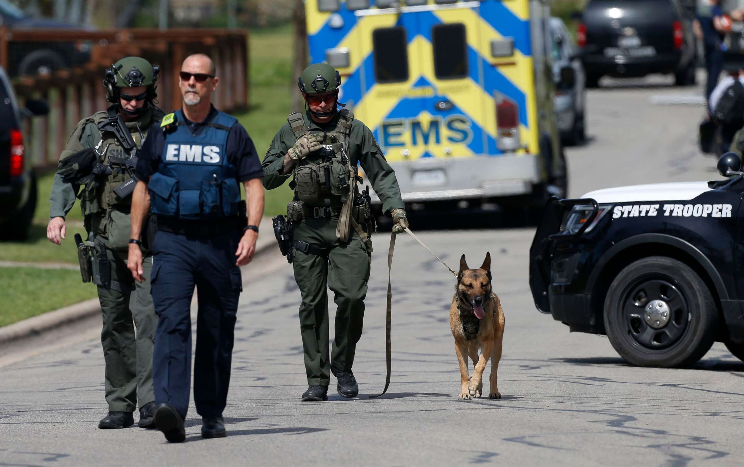 PHOTO: Police walk through a Pflugerville neighborhood as the FBI investigates the home of Austin bombing suspect Mark Anthony Conditt, March 21, 2018. 