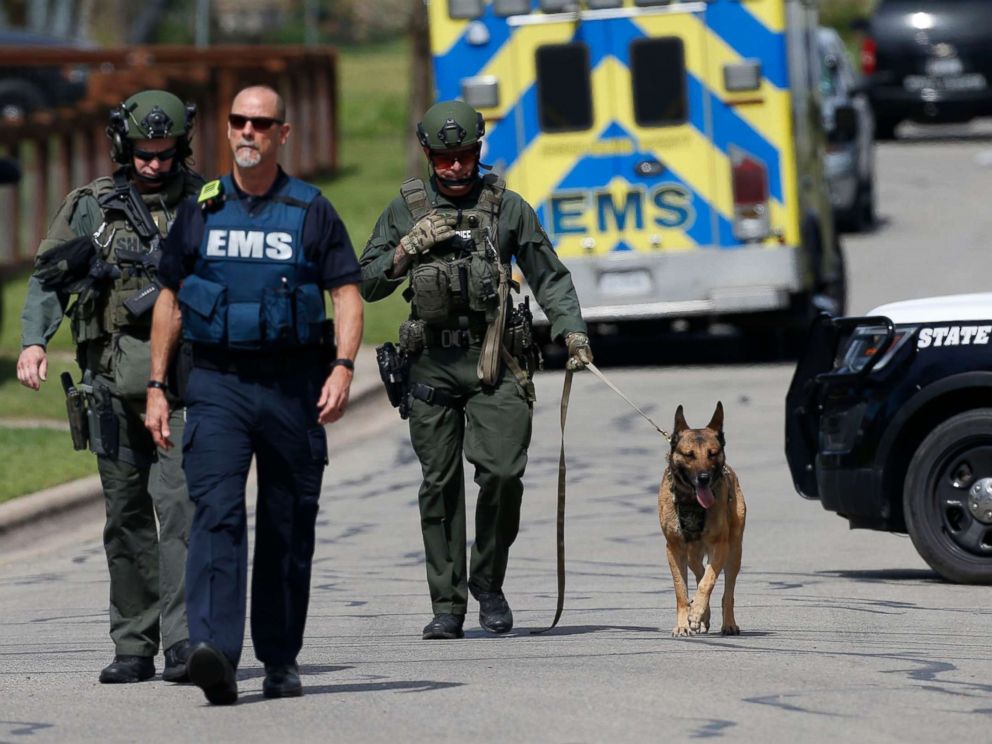 PHOTO: Police walk through a Pflugerville neighborhood as the FBI investigates the home of Austin bombing suspect Mark Anthony Conditt, March 21, 2018.