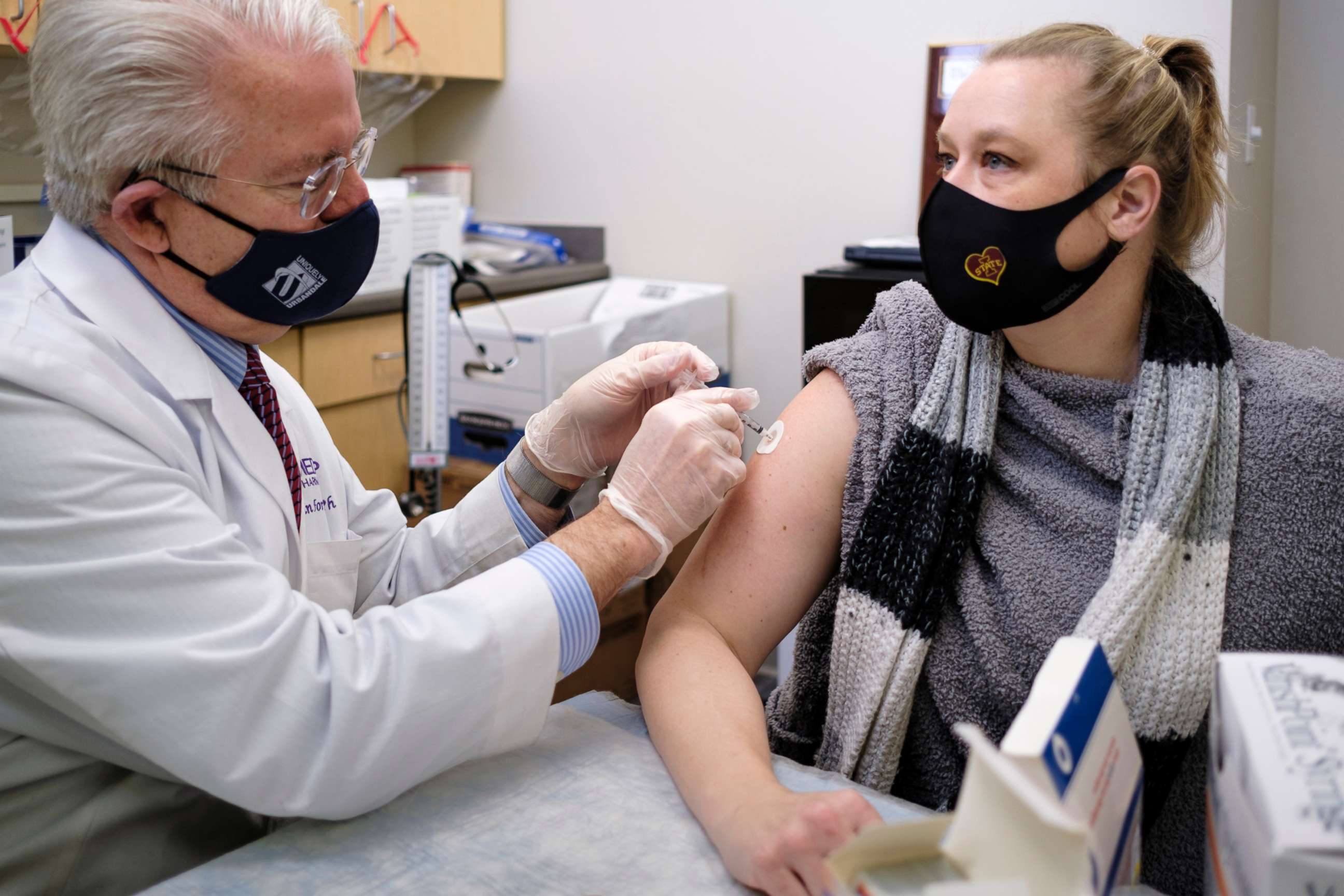 PHOTO: Pharmacist John Forbes gives the Moderna GOVID-19 vaccine to Meghan Bohlander, a physician's assistant, at the Medicap Pharmacy in Urbandale, Iowa, Jan. 5, 2021.