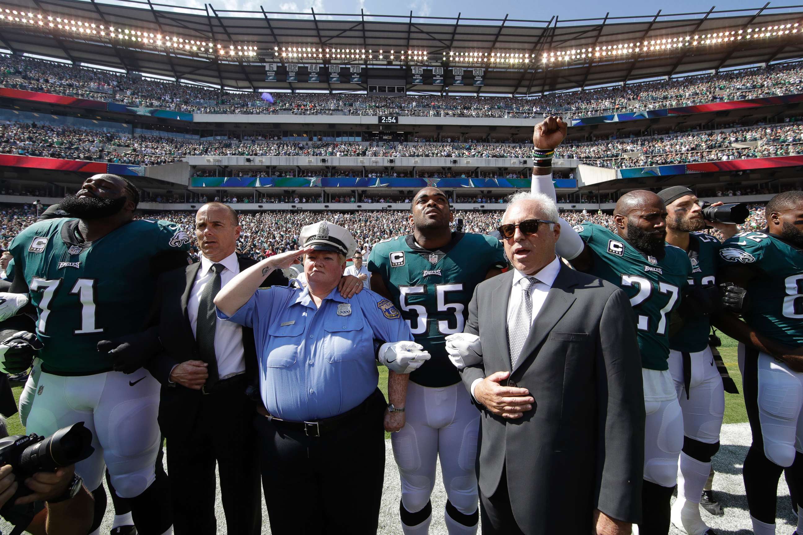 PHOTO: Philadelphia Eagles players and owners Jeffrey Lurie stand for the national anthem before an NFL football game against the New York Giants, Sept. 24, 2017, in Philadelphia.