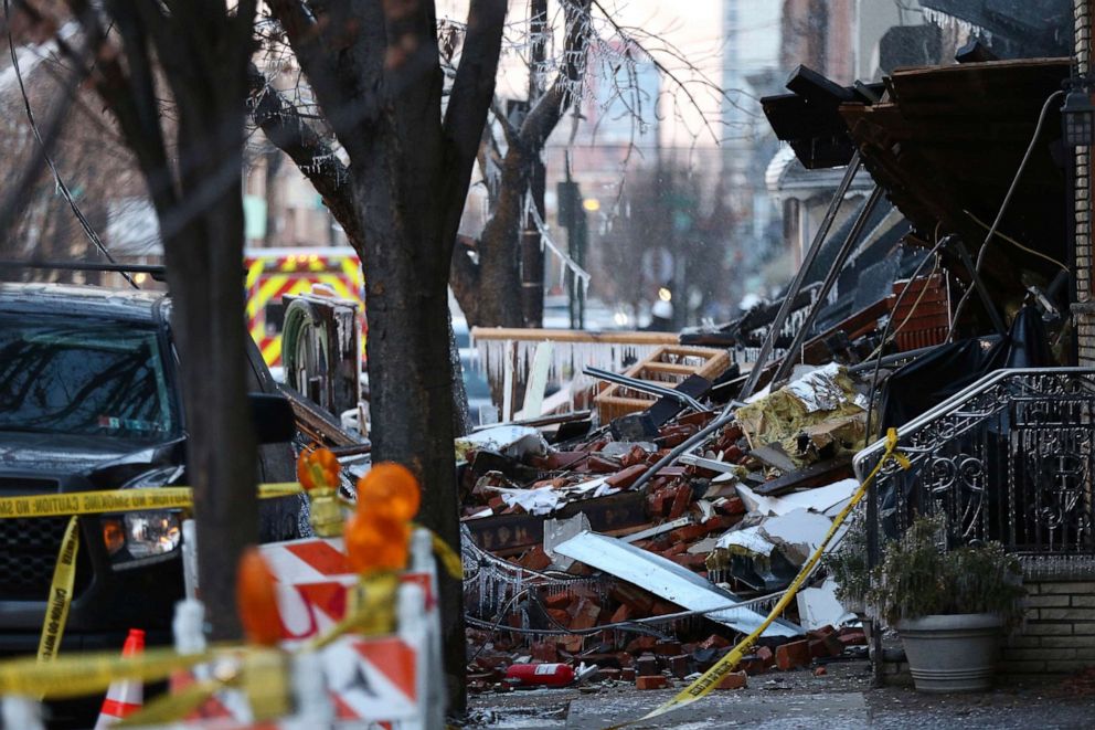 PHOTO: Debris is scattered at the scene of Thursday's explosion and fire that destroyed several row homes in Philadelphia, Dec. 20, 2019. 