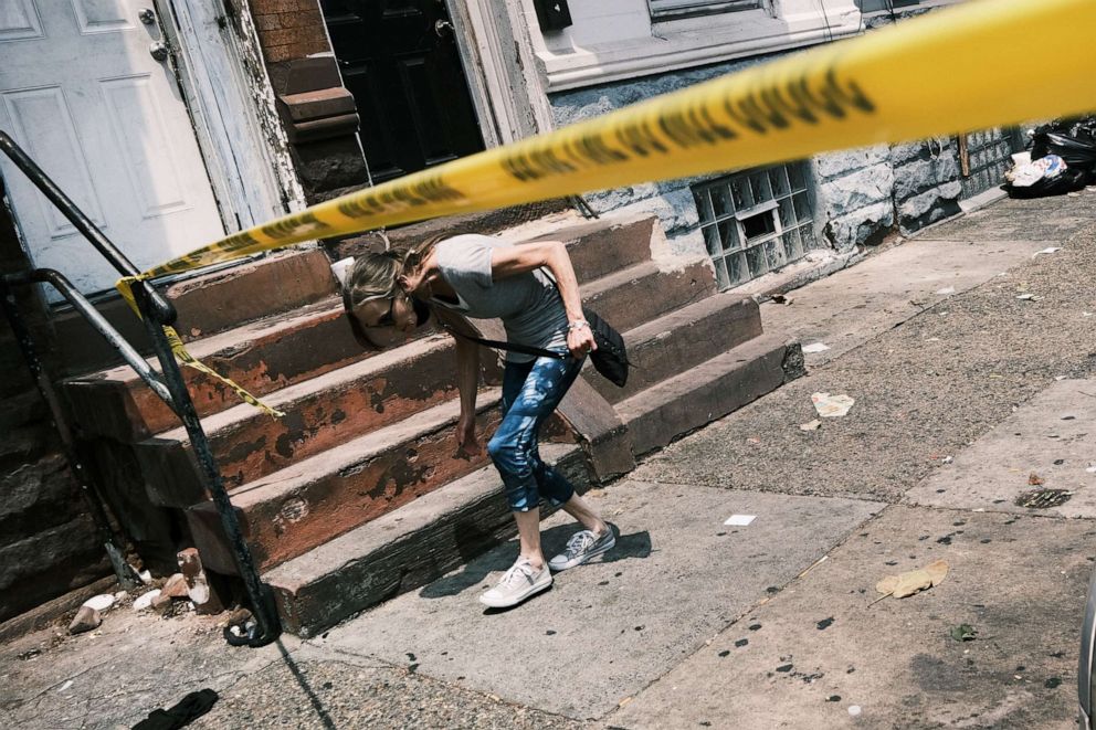 PHOTO: Police tape blocks a street where a person was recently shot in a drug related event in in Philadelphia,  July 19, 2021.