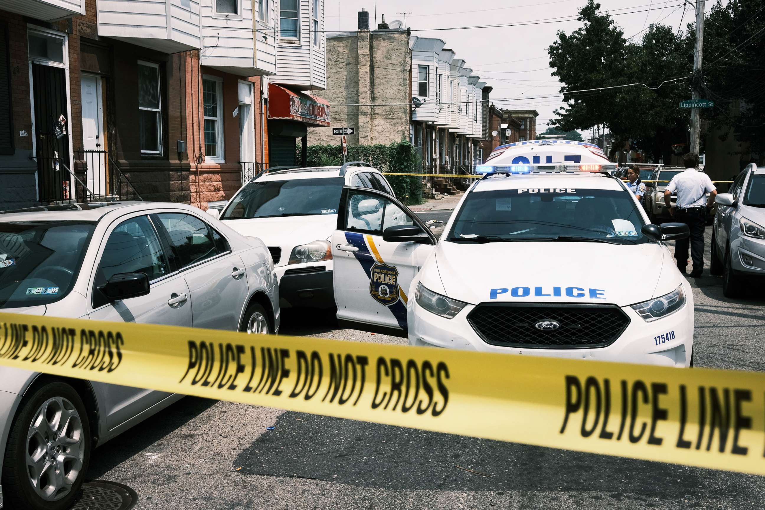 PHOTO: Police tape blocks a street where a person was recently shot in a drug related event in in Philadelphia,  July 19, 2021.