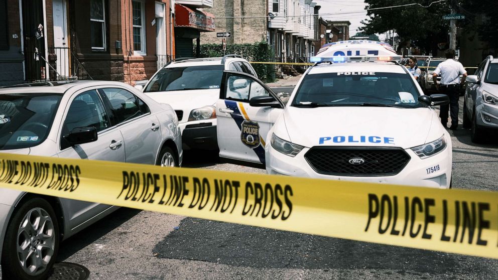 PHOTO: Police tape blocks a street where a person was recently shot in a drug related event in in Philadelphia,  July 19, 2021.