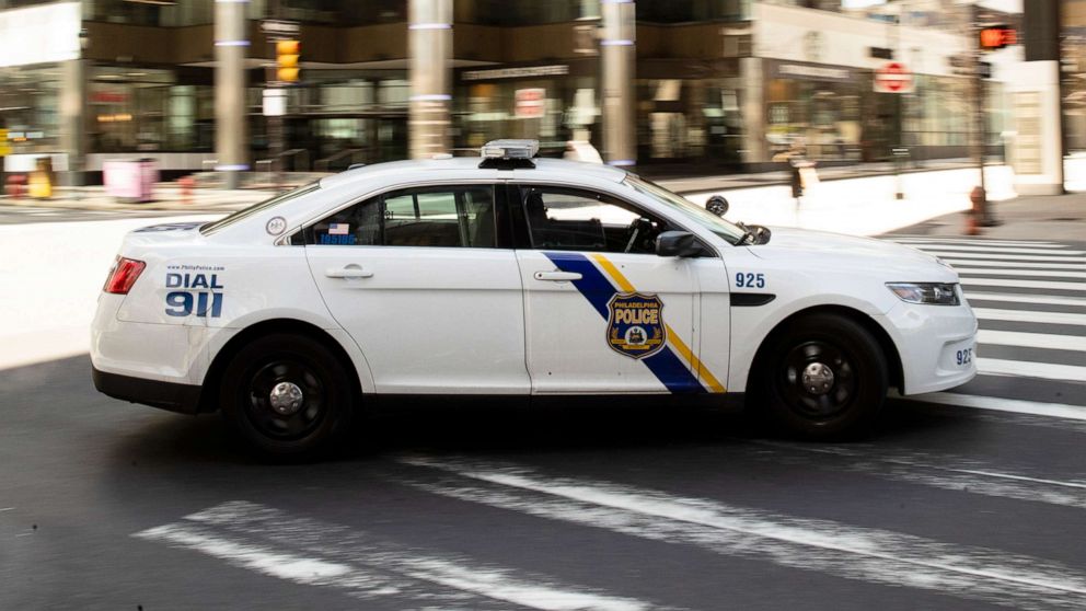 PHOTO: A police car drives in Philadelphia, March 24, 2020.