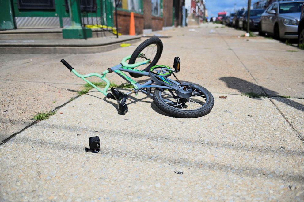 PHOTO: A bicycle is pictured at the scene as investigations are ongoing the day after a mass shooting in the Kingsessing section of southwest Philadelphia, July 4, 2023.