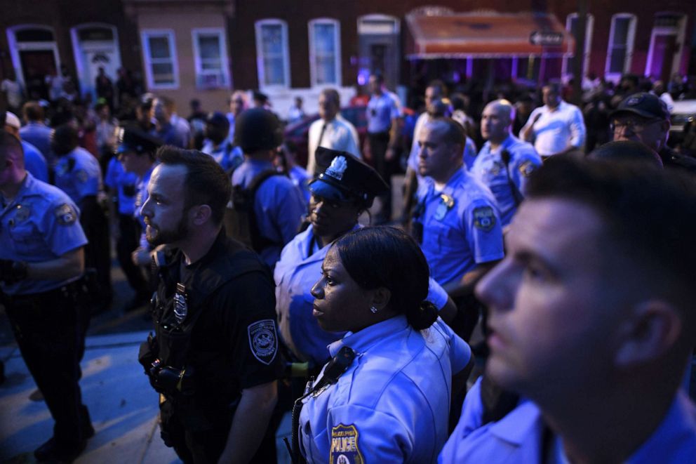 PHOTO:Police officers monitor activity near a residence while responding to a shooting on August 14, 2019 in Philadelphia.