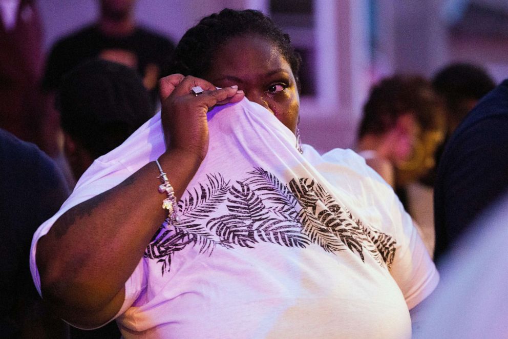 PHOTO: A bystander wipes her eyes after being pepper sprayed by the Philadelphia police in Philadelphia, Aug. 14,  2019.