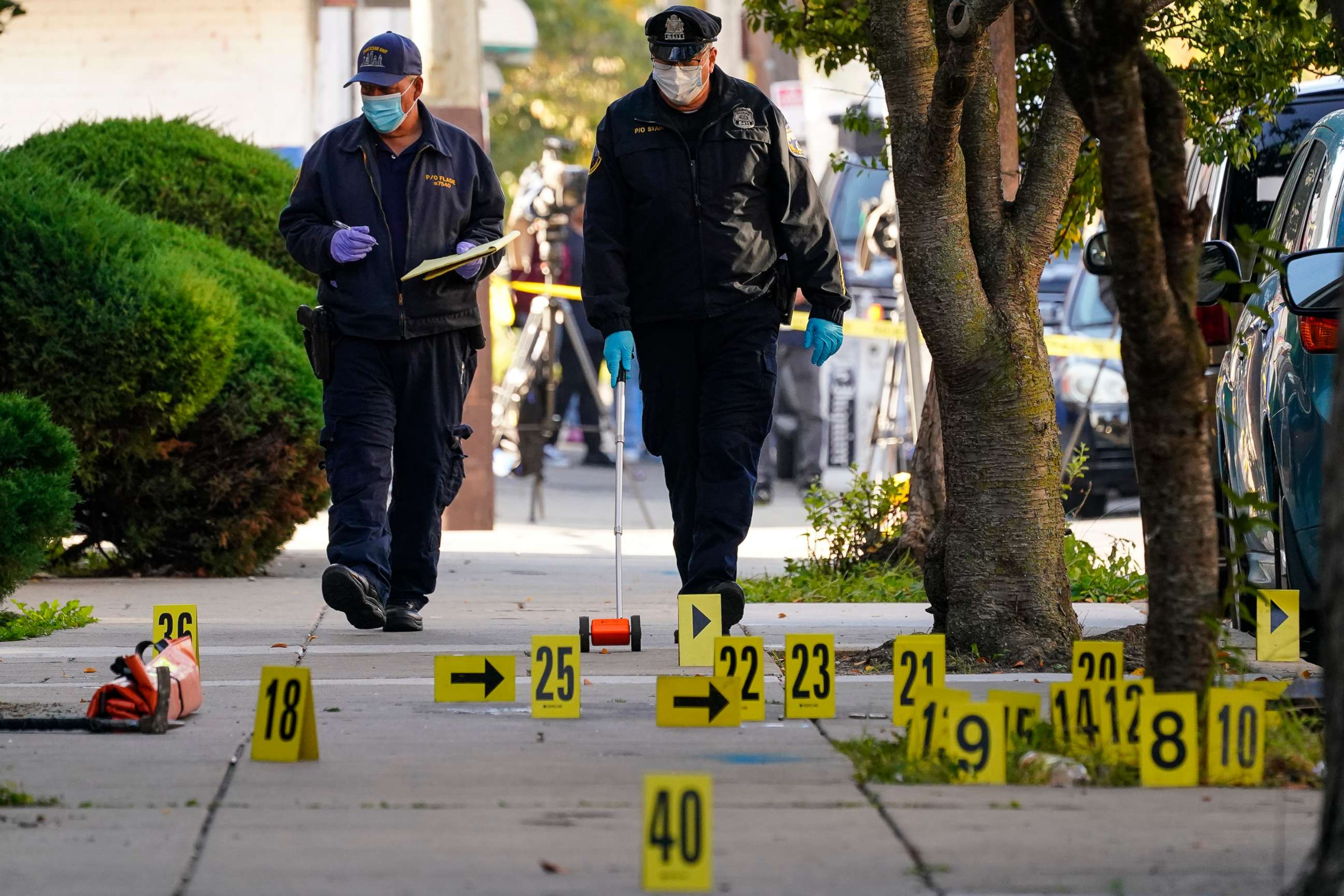 PHOTO: Investigators work the scene where multiple people were shot including police officers when a SWAT team attempted to serve a homicide warrant in Philadelphia, Oct. 12, 2022.