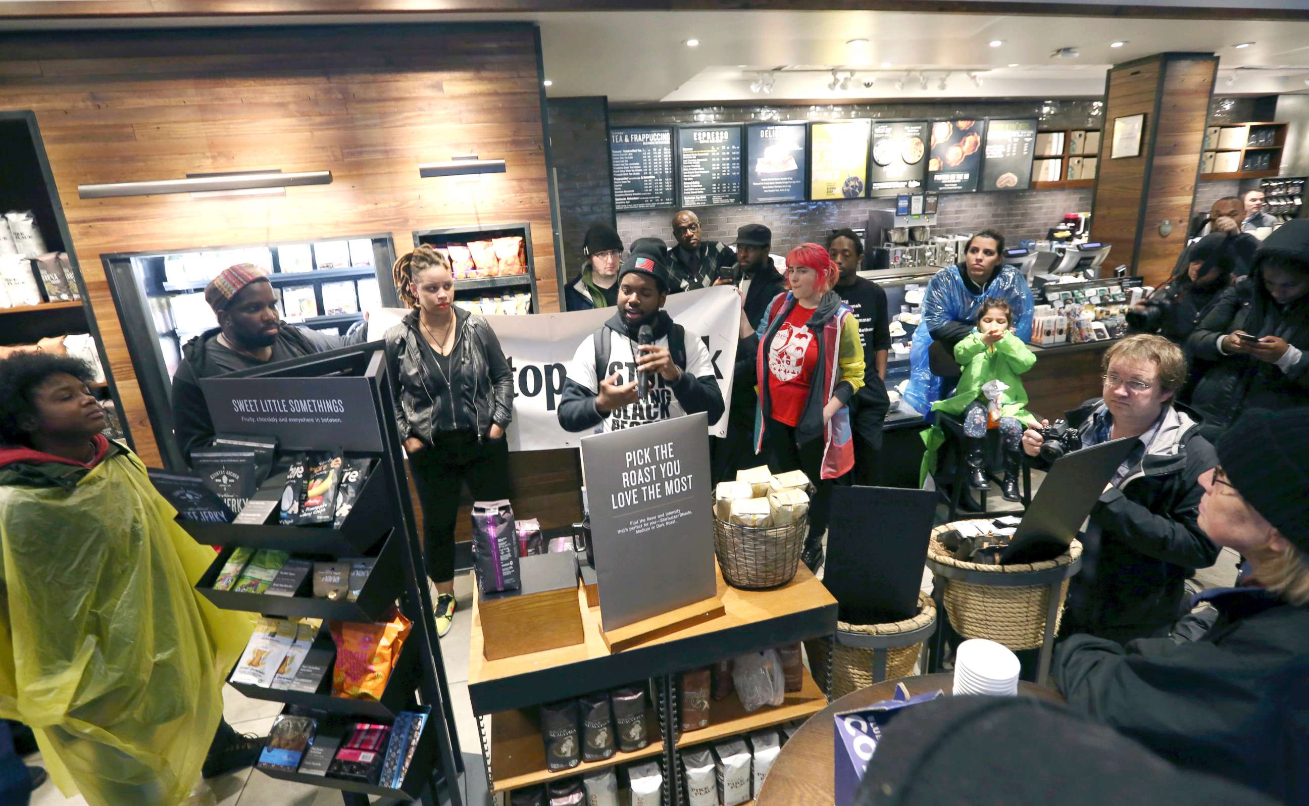 PHOTO: Demonstrators occupy the Starbucks that has become the center of protests Monday, April 16, 2018, in Philadelphia.