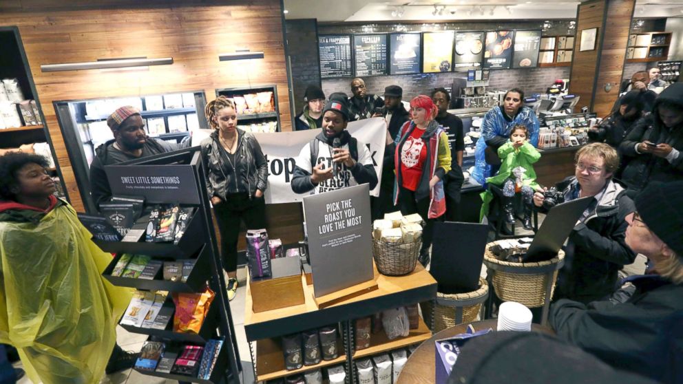 PHOTO: Demonstrators occupy the Starbucks that has become the center of protests Monday, April 16, 2018, in Philadelphia.