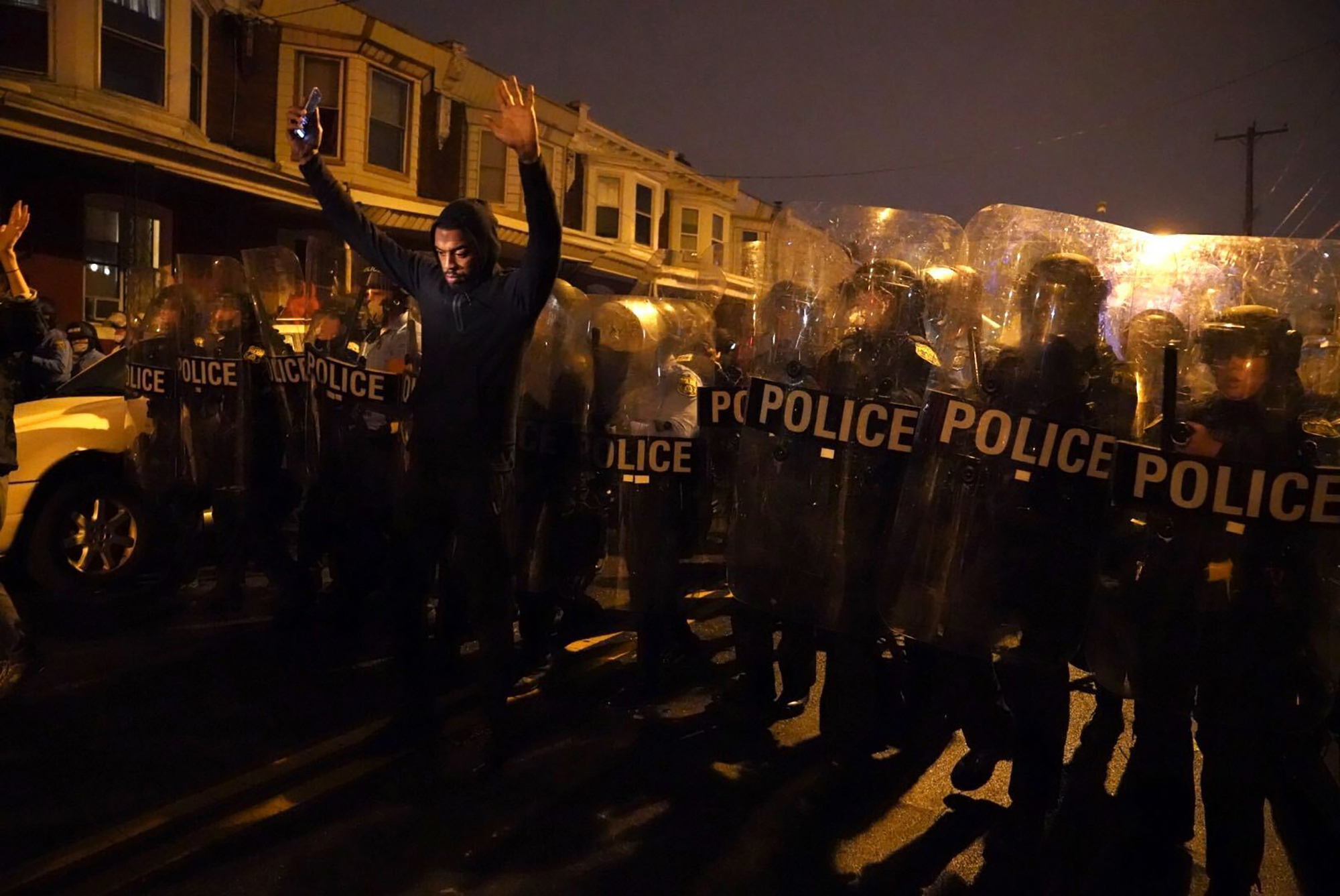 PHOTO: Sharif Proctor lifts his hands up in front of the police line during a protest in response to the police shooting of Walter Wallace Jr., Oct. 26, 2020, in Philadelphia.