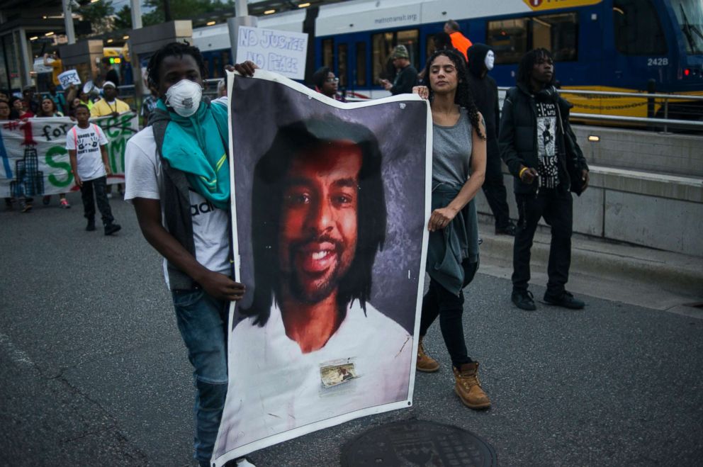 PHOTO: Protesters carry a portrait of Philando Castile on June 16, 2017 in St. Paul, Minn. 