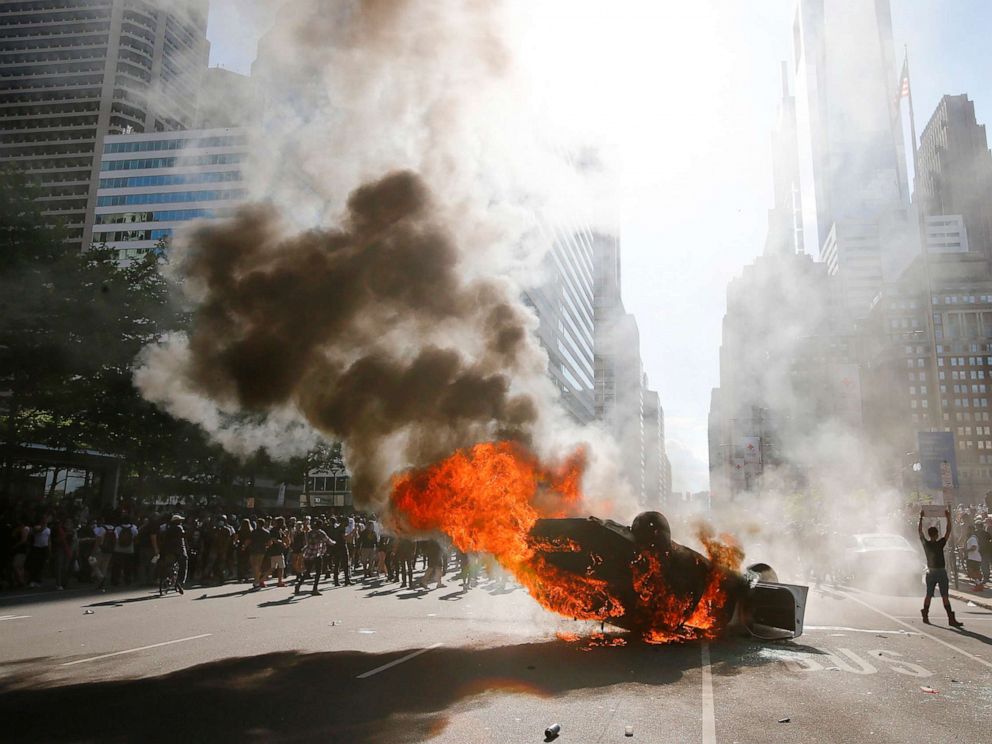 PHOTO: Smoke rises from a fire engulfing a police cruiser in Center City during the "Justice for George Floyd" protest, May 30, 2020, in Philadelphia.
