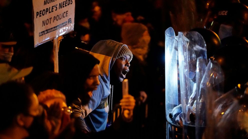 PHOTO: Protesters confront police during a march, Tuesday, Oct. 27, 2020, in Philadelphia. Hundreds of demonstrators marched in West Philadelphia over the death of Walter Wallace, a Black man who was killed by police in Philadelphia on Monday.