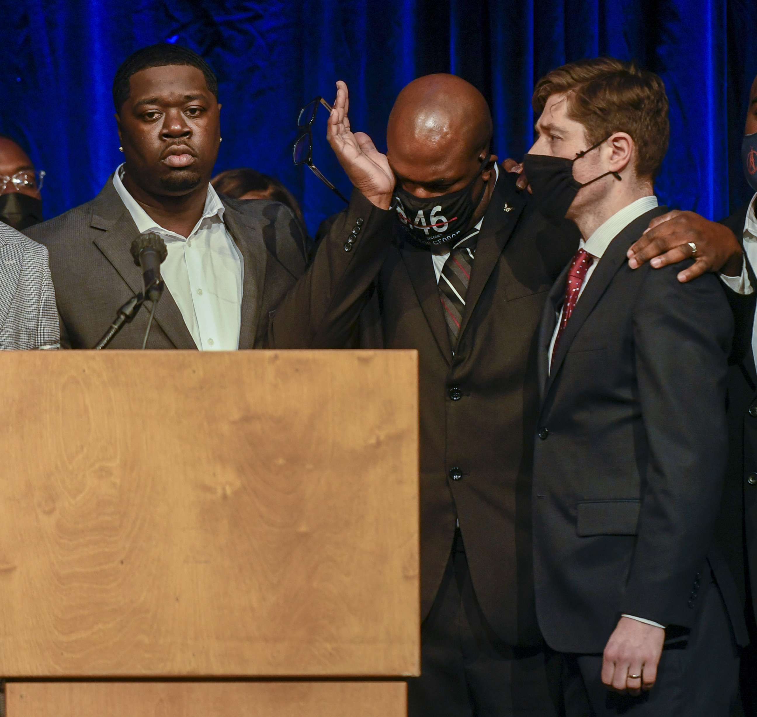 PHOTO: George Floyd's brother, Philonise Floyd, puts his arm around Minneapolis Mayor Jacob Frey as George Floyd's nephew Brandon Williams looks on during a press conference in Minneapolis, March 12, 2021.