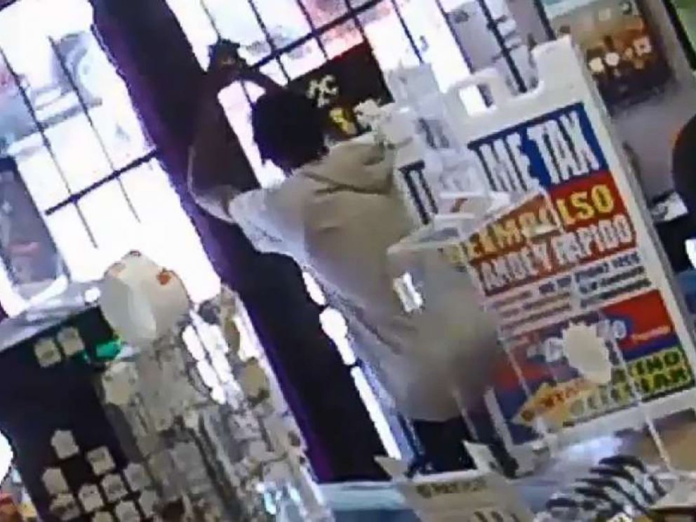 PHOTO: Houston robber John Bell tries to shoot his way out and when that fails, prays after getting locked in store by fleeing employees who lock the door behind them.