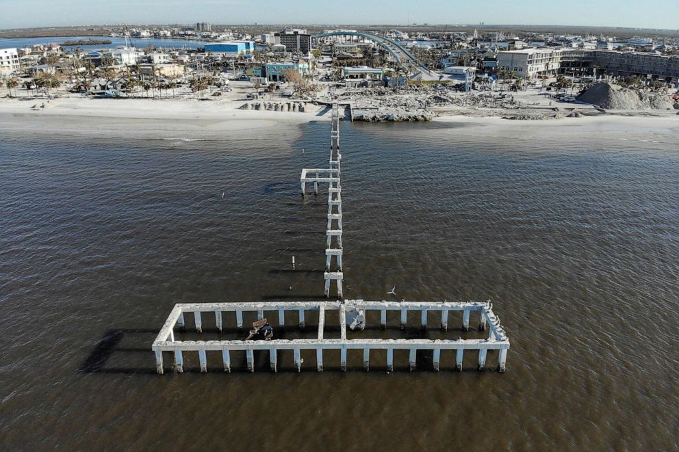 PHOTO: Remains of destroyed restaurants, shops, the Fort Myers Fishing Pier are seen almost one month after Hurricane Ian made landfall in Fort Myers Beach, Fla., Oct. 26, 2022.