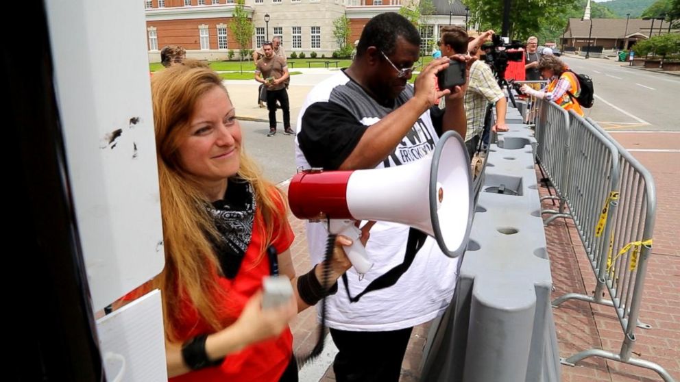 PHOTO: Daryle Lamont Jenkins, right in black and white, an antifa researcher and founder of One People's Project, and Lacy MacAuley, left, a prominent antifa movement organizer, are pictured on April 29, 2017.