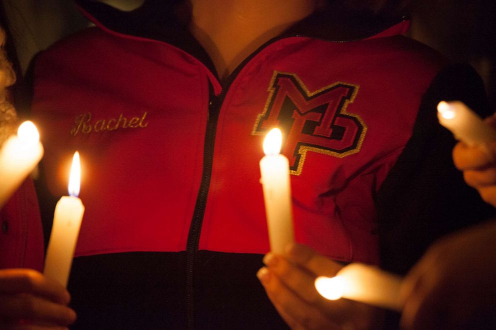  Students from Marysville-Pilchuck High School hold candles during a vigil, Oct. 24, 2014, in Marysville, Wash. After a shooting at the high school at least two are dead, including the gunman, with several more wounded.					